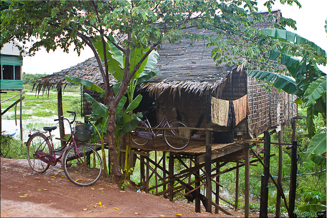 Thatched house on poles over the Tonle Sap River, Kampong Khleang