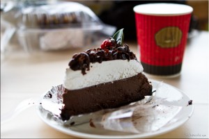Chocolate mouse cheesecake and coffee in a paper cup