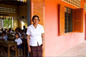Khmer teacher at the open door of her classroom.