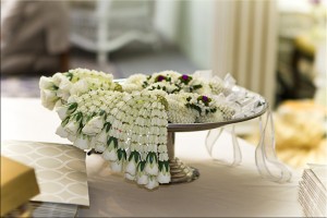 Garlands of jasmine and roses on a plate.