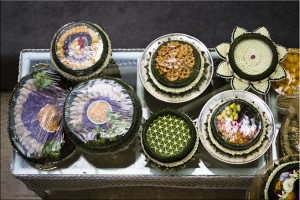 View from above: decorative plates of Thai food and flowers.