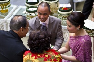 View from above: two young thai adults with two elder thais.