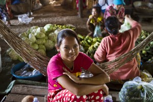 Portrait: Female khmer teen, sitting, Markets, Kampong Thom