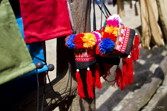 Bags with tassels of red, yellow, blue and white wool.