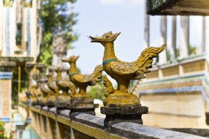 Golden mythical rooster on a banister.