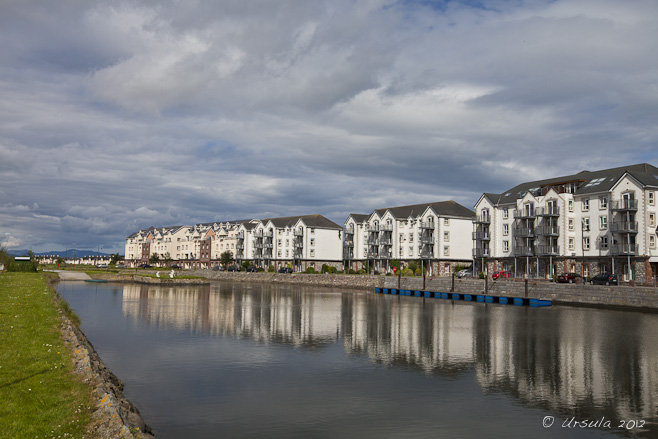 White town-houses lining a modern canal, Tralee, Ireland.