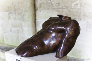 Sculpture of a reclining male torso.