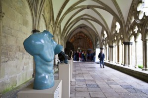 Cloisters of Salisbury Cathedral with a blue sculpture of a male torso.