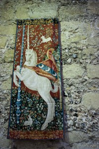Tapestry of a white unicorn.