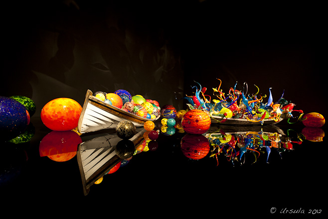 Wooden row boats filled with colourful glass by Dale Chihuly.