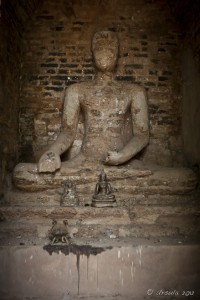 Laterite-brick Buddha in a shrine