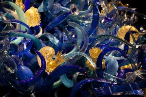 Yellow glass nails in blue glass waves.