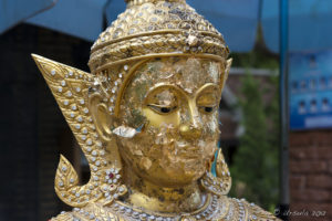 Gold leaf on a Thai Bodhisattva head.