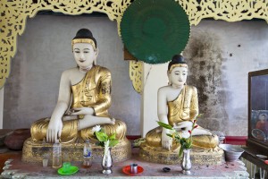 Two marble burmese buddhas seated in Shwemawdaw Temple, Bago, Myanmar