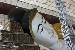 Shwethalyaung Buddha Head resting on jewelled caskets.
