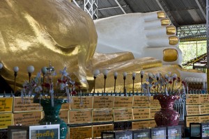 Looking down along the reclining Shwethalyaung Buddha to the feet and golden toe nails.