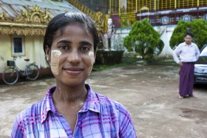 Portrait: Young burmese woman in the courtyard of Postcard Seller, Shwethalyaung