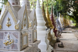 Long row of colourful Thai stupas.