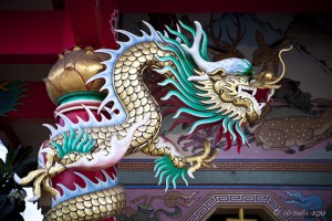 Richly decorated Chinese Dragons outside a temple.