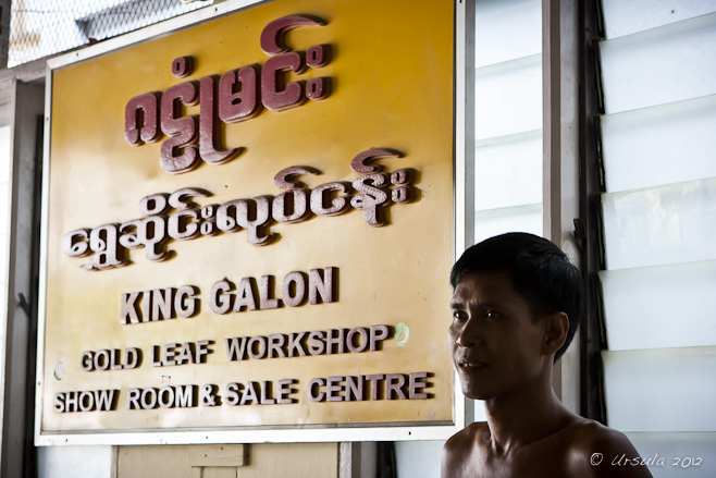 Portrait: shirtless Burmese male next  to the King Galon Gold Leaf Workshop
