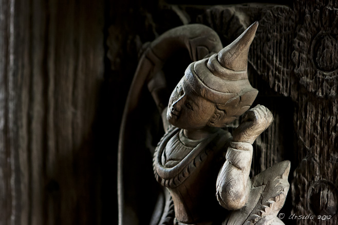 A Buddhist/Hindu Deva carved in bold relief on a teak door, Shwenandaw Kyaung Monastery 