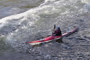 Kayaker paddling into white water: Skookumchuk Narrows