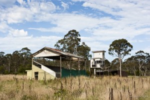Lanscape: Old racetrack grandstand surrounded by grass, Pamboola Wetlands, NSW, AU