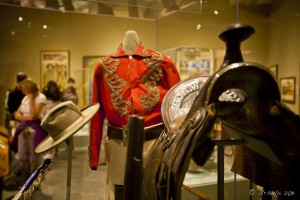 Museum case: Hon. W.F. Cody Uniform and saddle