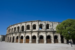Well preserved Roman amphitheatre against a blue sky, Nîmes.