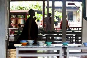 Silhouette of a theravada buddhist monk in a lunchroom, Mahagandayon Monastery