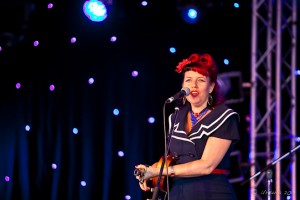Portrait: Red-haired Lil' Fi performing with her ukulele, Bluesfest 2013