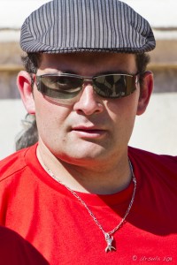 Portrait: French man in a cap and red tee, Les Arènes de Nimes