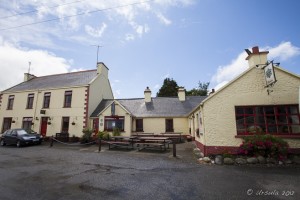 View of a cream and maroon coloured inn: Monks Pub, Ballyvaughan Village, Co Clare, Ireland