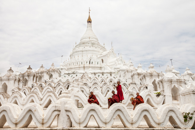 Four novice burmese monks on the lower terraces of Hsinbyume Pagoda, Mingun, Myanmar