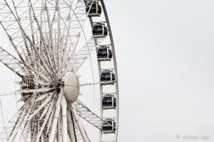 Close-up: the white centre and shiny carriages of the Brighton Wheel, Brighton beach, UK
