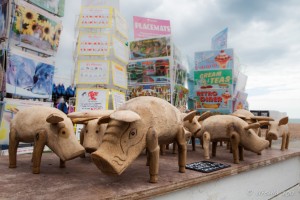 Wooden pigs and greeting cards for sale, Brighton Beach, UK
