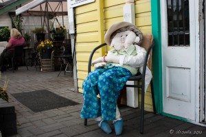 A large stuffed rag-doll sits on a chair, Chemainus, BC