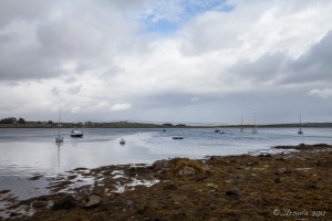 Overcast sky over boats moored on low tide, Clifden Galway