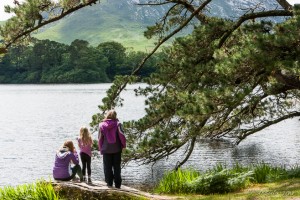 Woman and two children overlooking the lake, Kylemore Abbey.