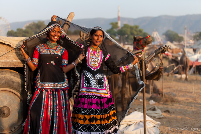 Environmental portrait of two Kalbeliya gypsies in traditional costumes, Pushkar, India.