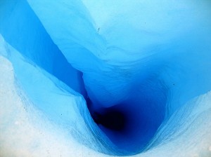 Deep blue hole in glacial ice, Perito Moreno
