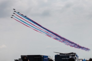 Eight South Korean Supersonic T-50s trailing red and blue smoke, Singapore Airshow 2014