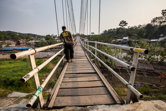 National Park guide on the suspension Bridge to Bukit Lawang.