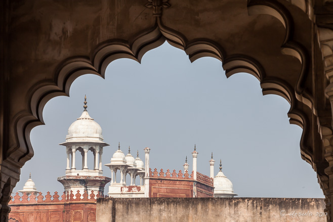 View of delicate white parapets of of Agra fort from the scalloped arches of the Diwan-i-aam, Agra  India