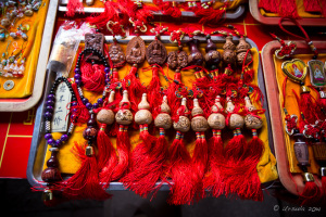 Prayer Beads and Buddha images on red thread, Longshan Temple, Quanzhou China