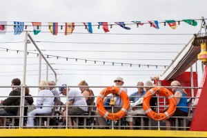 Passengers on the upper deck of a boat, Stuart Line CruisesExmouth, UK