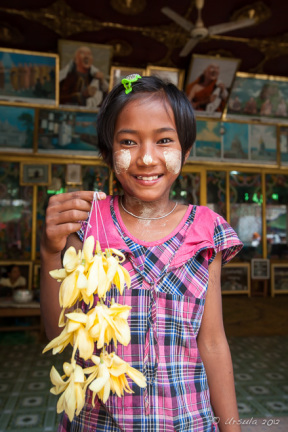 Young burmese girl with flower garlands, Mahagiri Shrine, Mount Popa, Myanmar