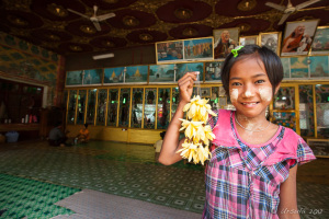 Young burmese girl with flower garlands, Mahagiri Shrine, Mount Popa, Myanmar