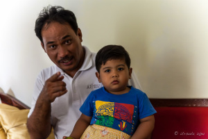 North Sumatran Baby and Dad, in a Medan home, North Sumatra, Indonesia