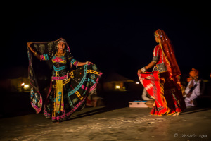 Two Kalbelia Dancers in ornate gypsy dresses and musicians, Manvar Desert Camp, Dechu, India